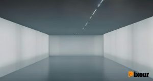 A cold, empty future museum interior displaying chaotic digital art without human curation